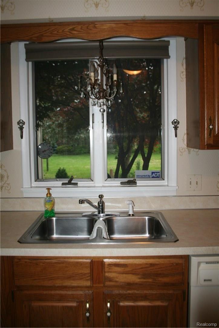 3112 Old Farm Road Flint, MI 48507 - Photo 7 of 18 Gorgeous view to flowering backyard from kitchen sink window