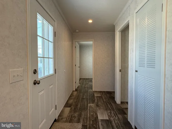 a view of a bathroom from the hallway