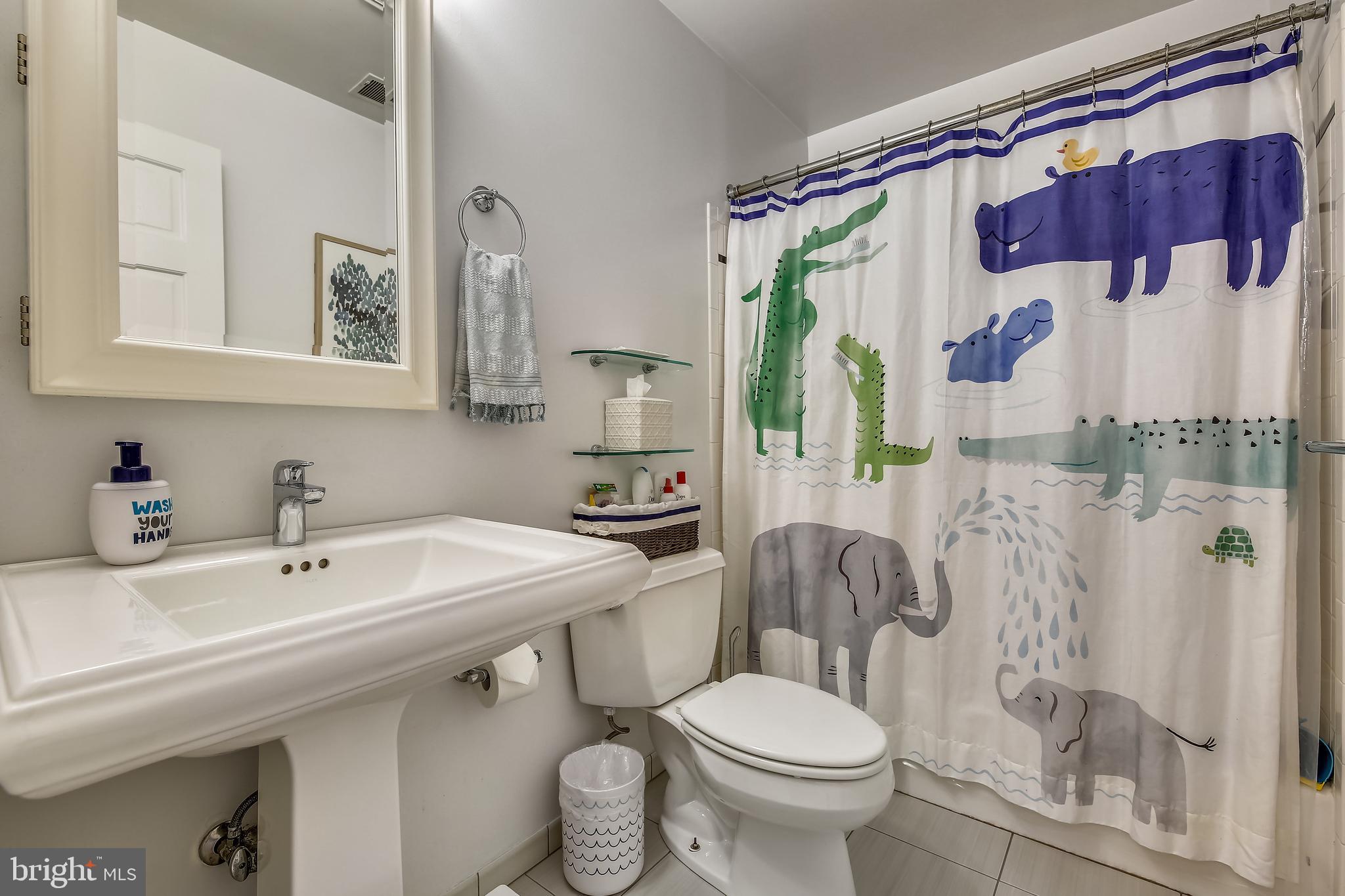 8011 Piney Branch Road Silver Spring, MD 20910 - Photo 21 of 35 Updated Hallway Bath w/ White Vanity