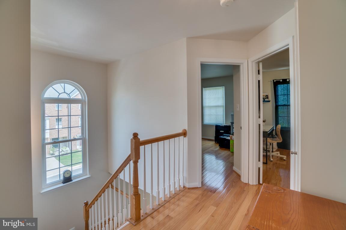 13100 Kidwell Field Road Herndon, VA 20171 - Photo 21 of 46 Upper level hallway with hardwood flooring