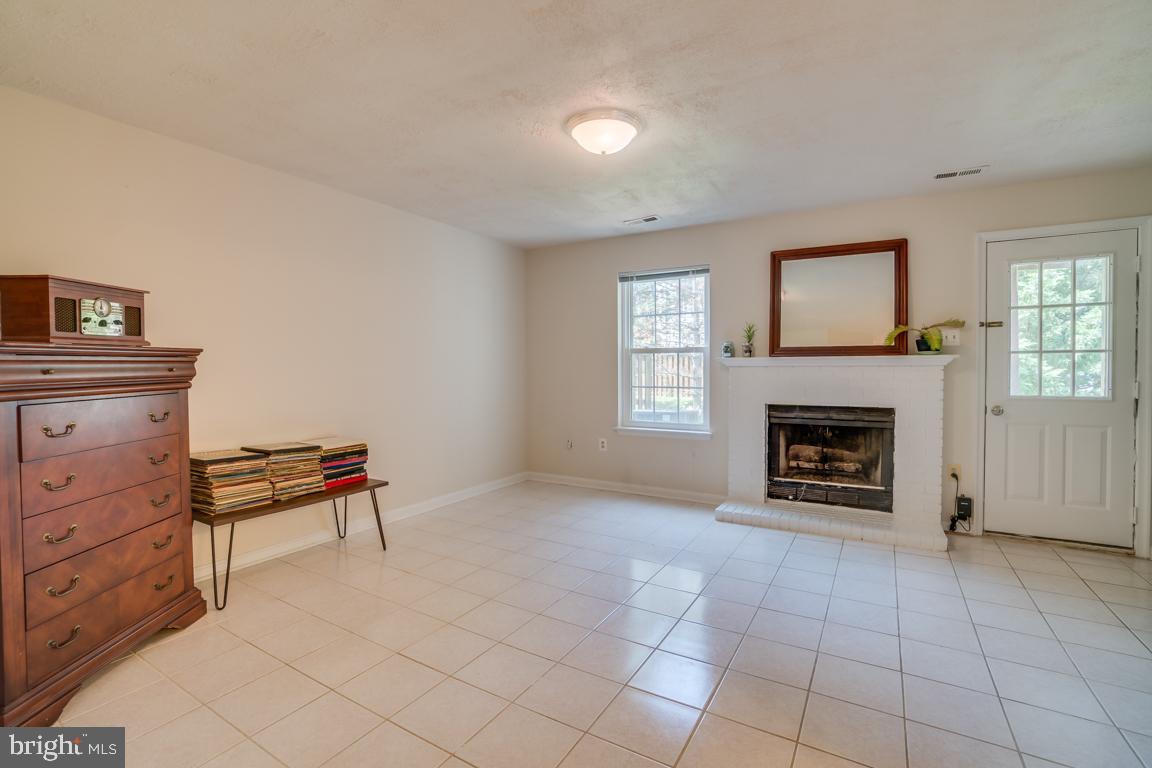 13100 Kidwell Field Road Herndon, VA 20171 - Photo 34 of 46 Lower level rec room with fireplace