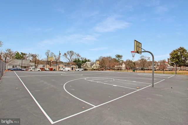 a view of a lake with boats and trees in the background