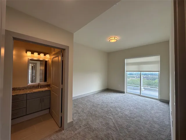 a view of balcony with wooden floor and a city view