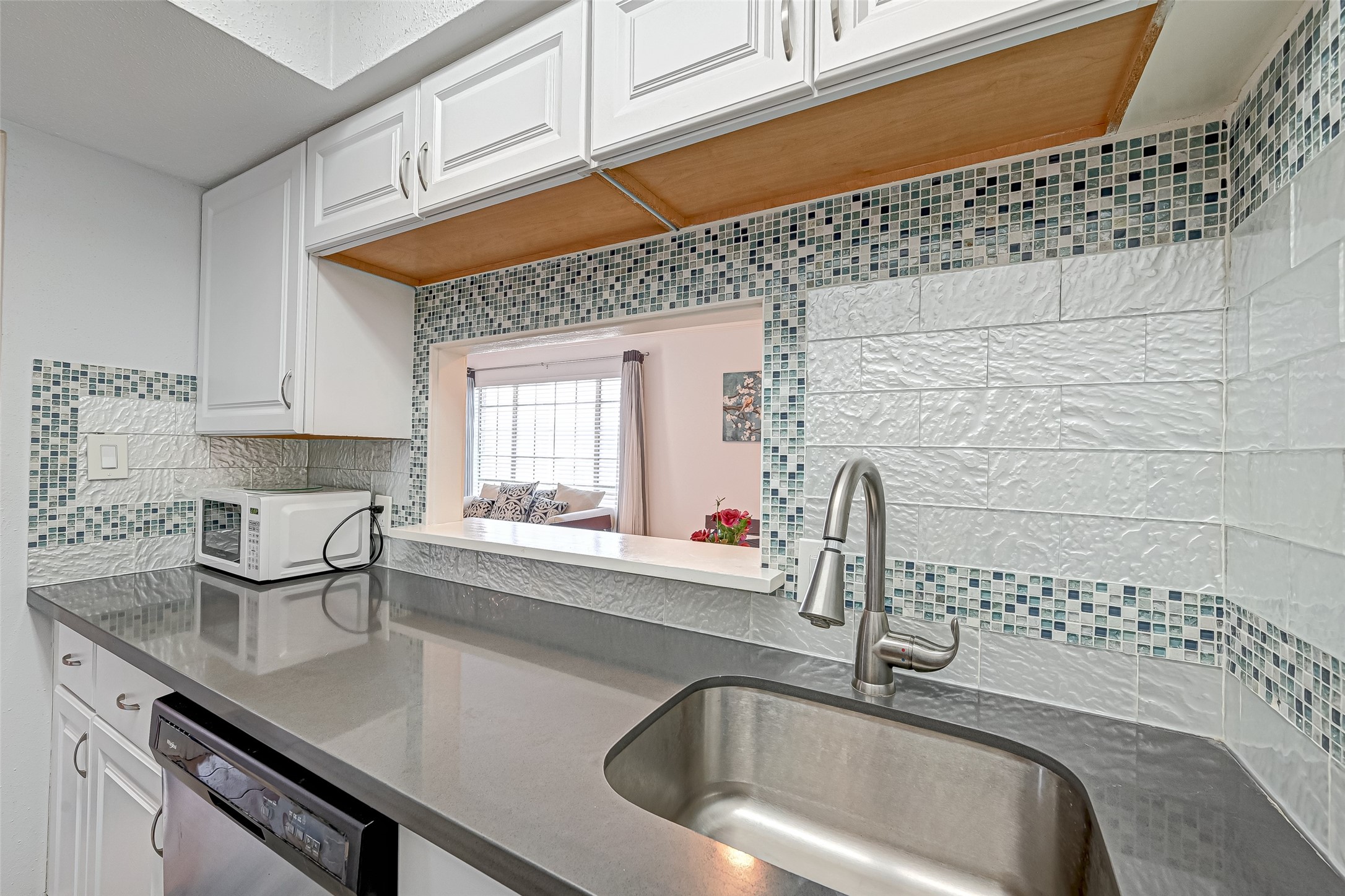 2201 Fountain View Drive, Unit 2 Houston, TX 77057 - Photo 16 of 28 a kitchen with a sink and cabinets
