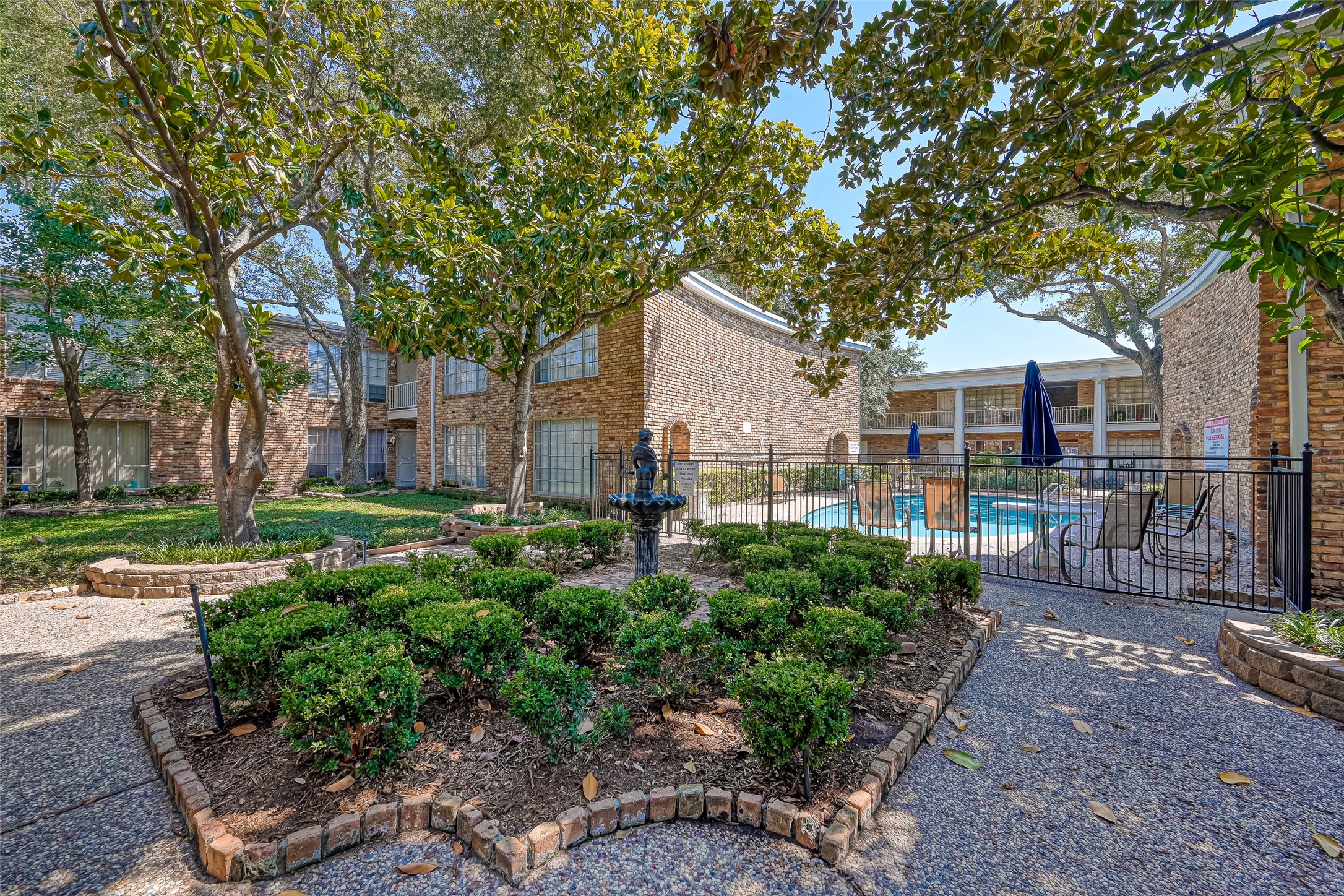 2201 Fountain View Drive, Unit 2 Houston, TX 77057 - Photo 2 of 28 a front view of a house with a garden
