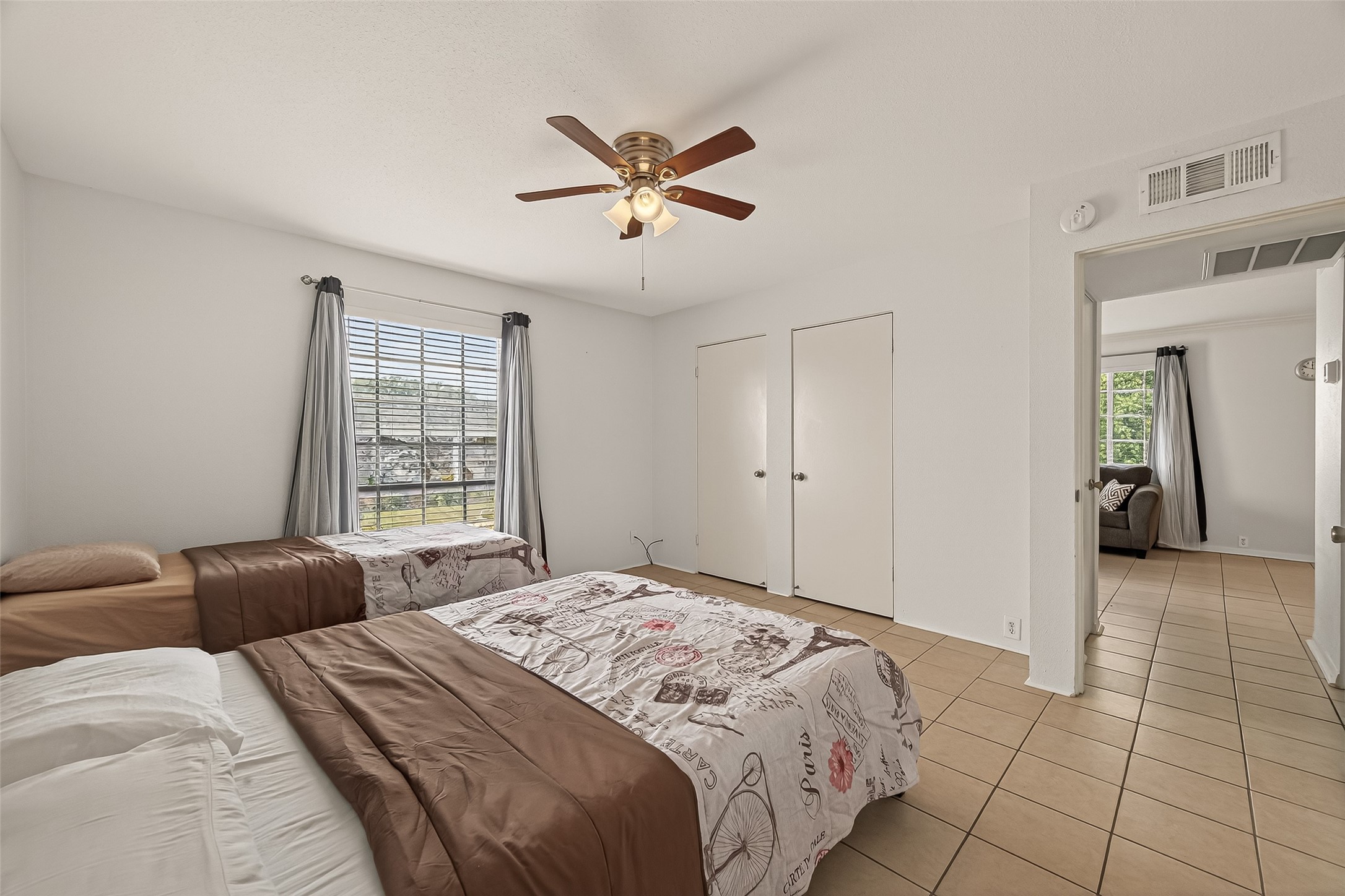 2201 Fountain View Drive, Unit 2 Houston, TX 77057 - Photo 21 of 28 a bedroom with a bed and a window
