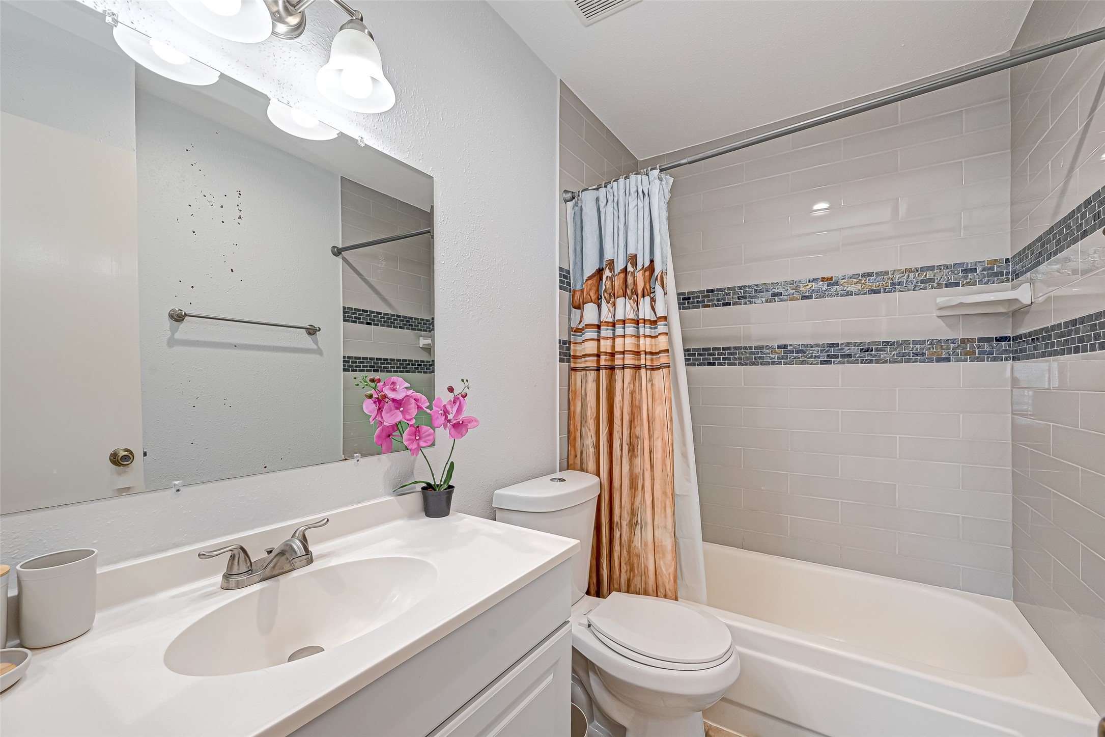 2201 Fountain View Drive, Unit 2 Houston, TX 77057 - Photo 22 of 28 a bathroom with a sink toilet and shower