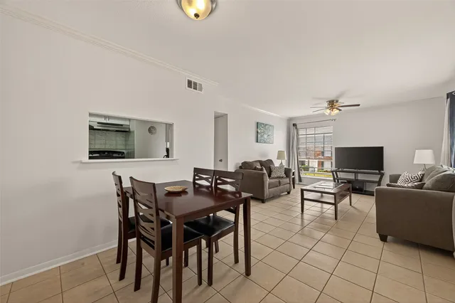 a view of a livingroom with furniture and a flat screen tv