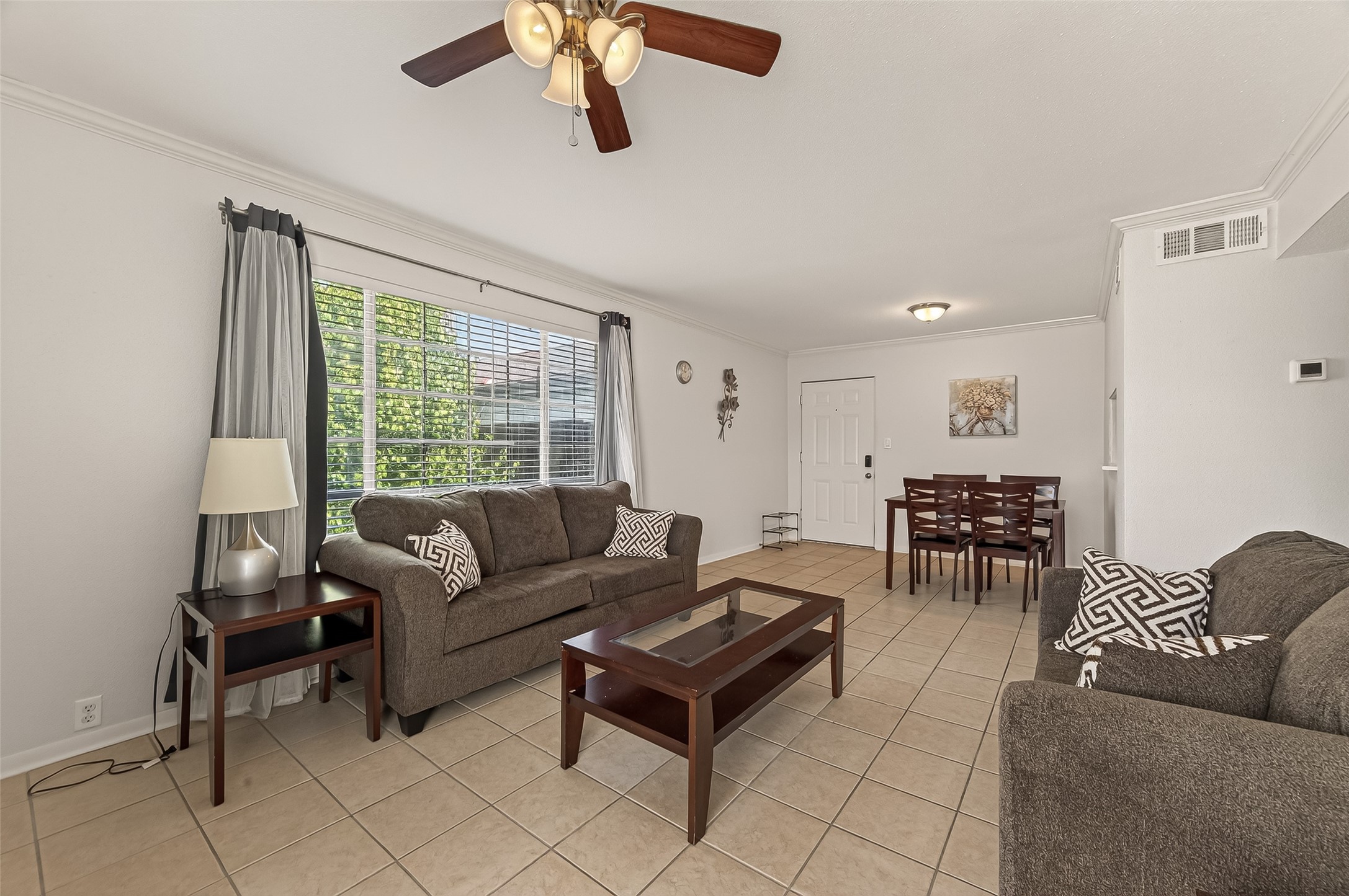 2201 Fountain View Drive, Unit 2 Houston, TX 77057 - Photo 10 of 28 a living room with furniture and a large window