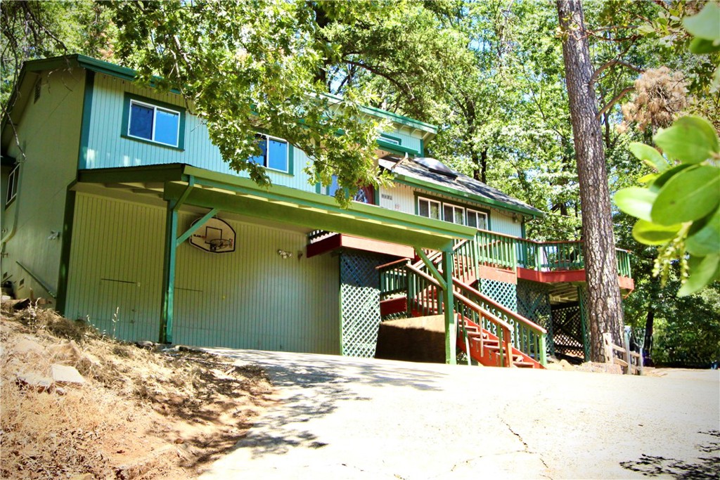 a view of a house with a tree