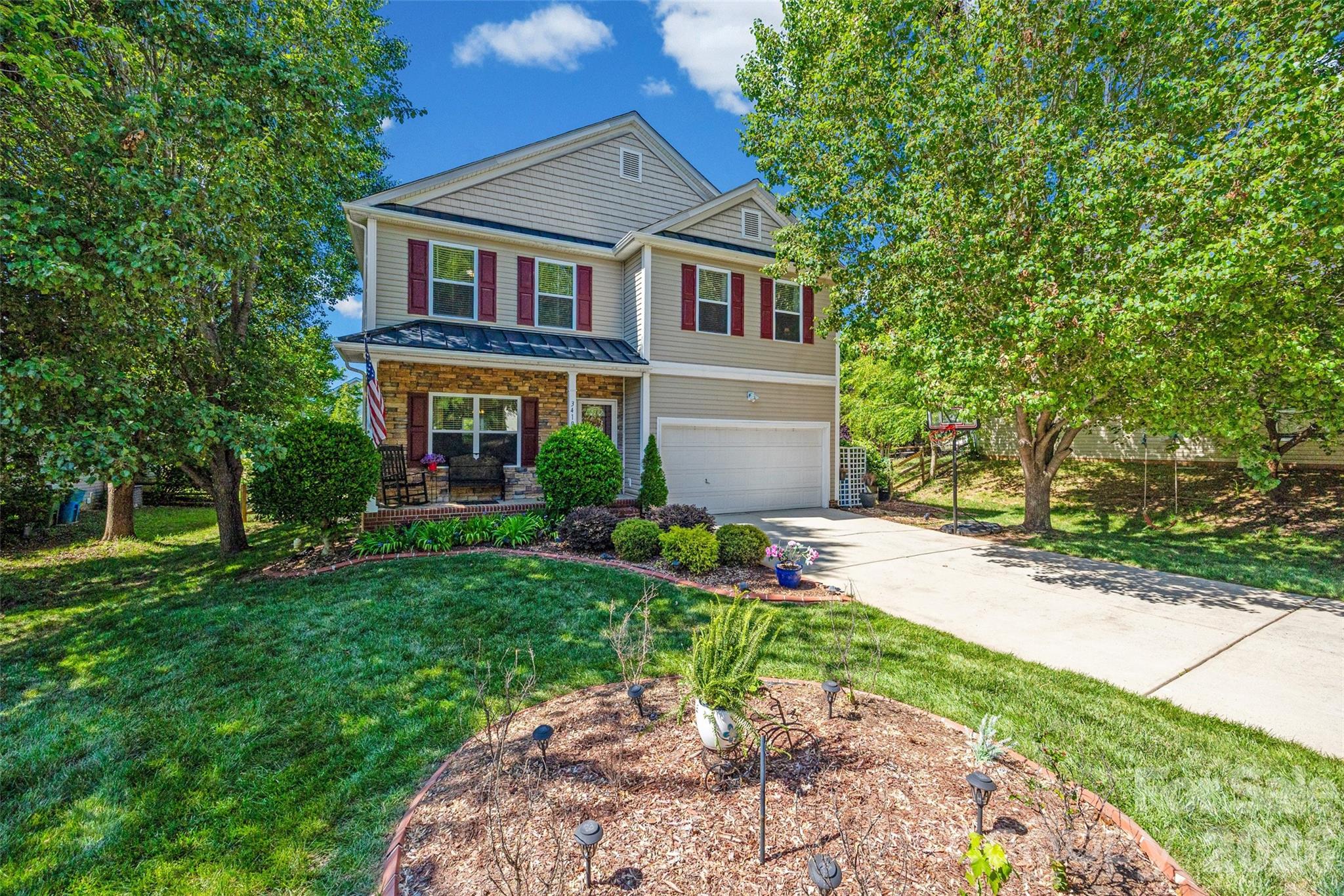 3419 Pickney Bluff Fort Mill, SC 29715 - Photo 1 of 36 a front view of a house with a yard and porch