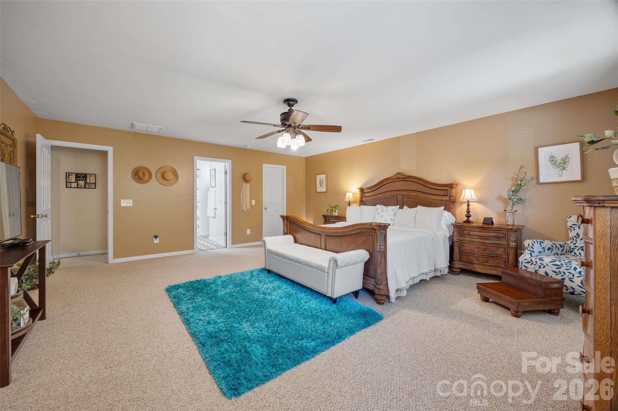 3419 Pickney Bluff Fort Mill, SC 29715 - Photo 20 of 36 a spacious bedroom with a bed and a couch
