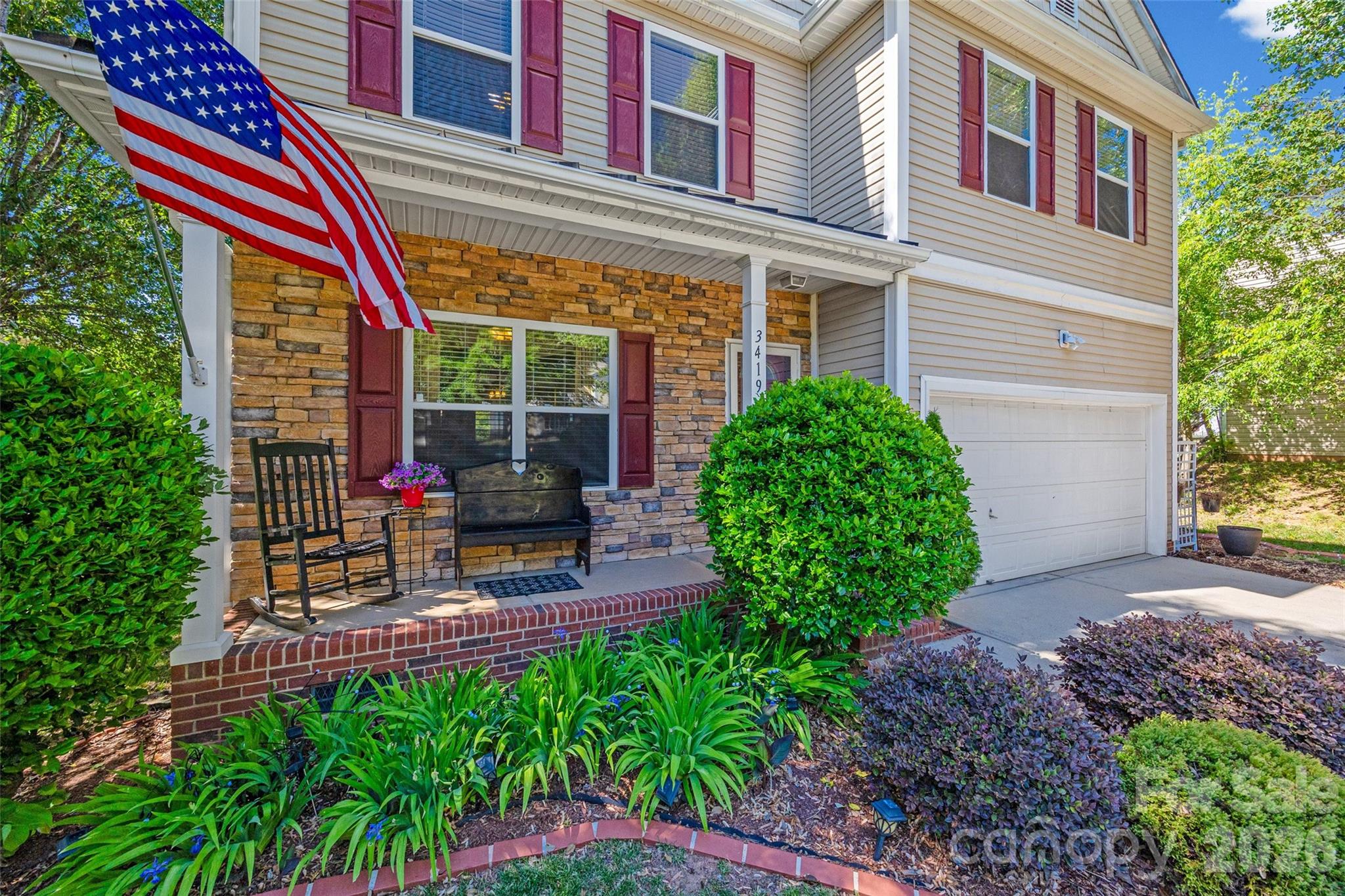 3419 Pickney Bluff Fort Mill, SC 29715 - Photo 2 of 36 a view of a house with a chairs and table in a patio