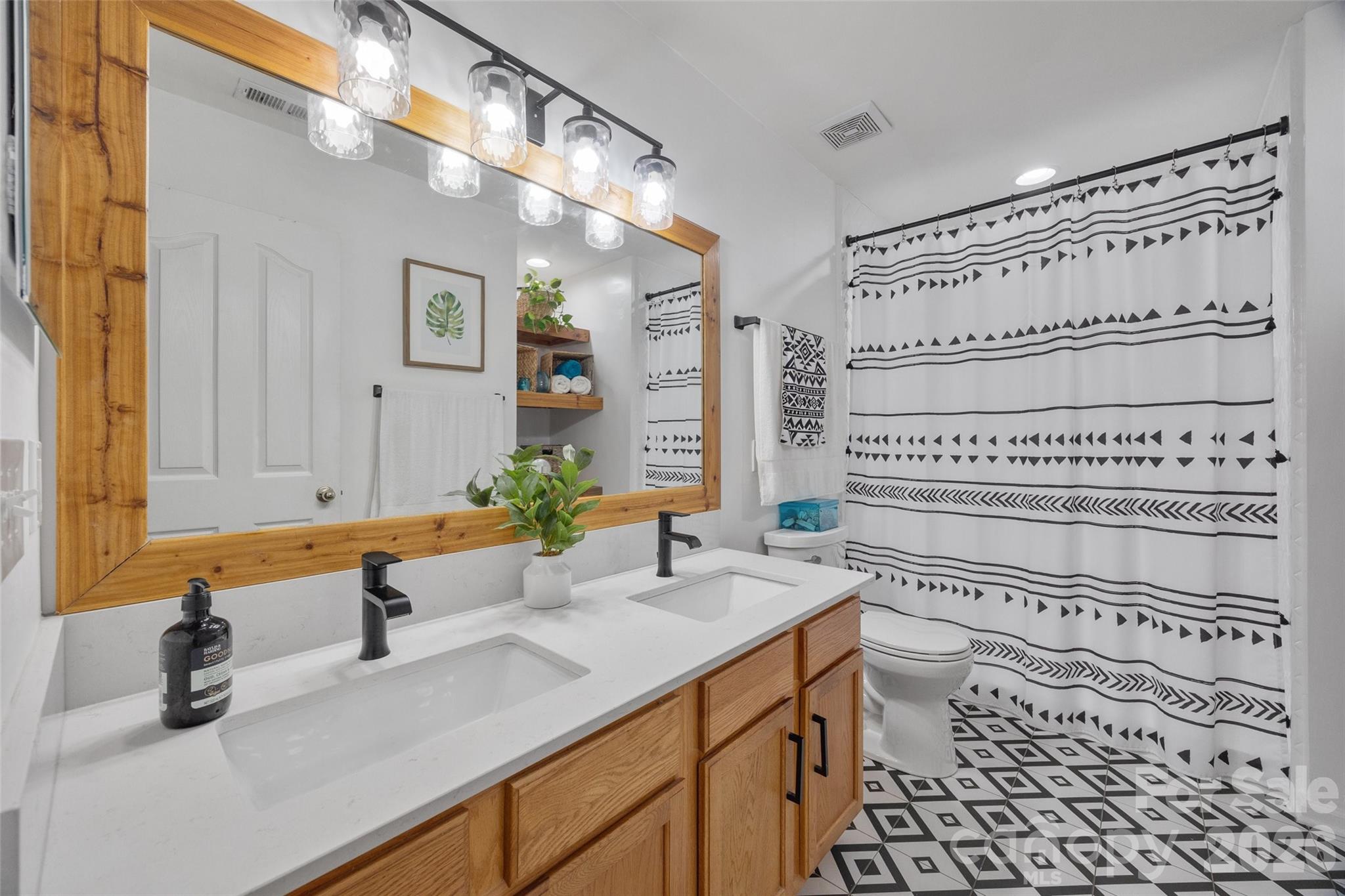 3419 Pickney Bluff Fort Mill, SC 29715 - Photo 21 of 36 a bathroom with a granite countertop sink and a mirror