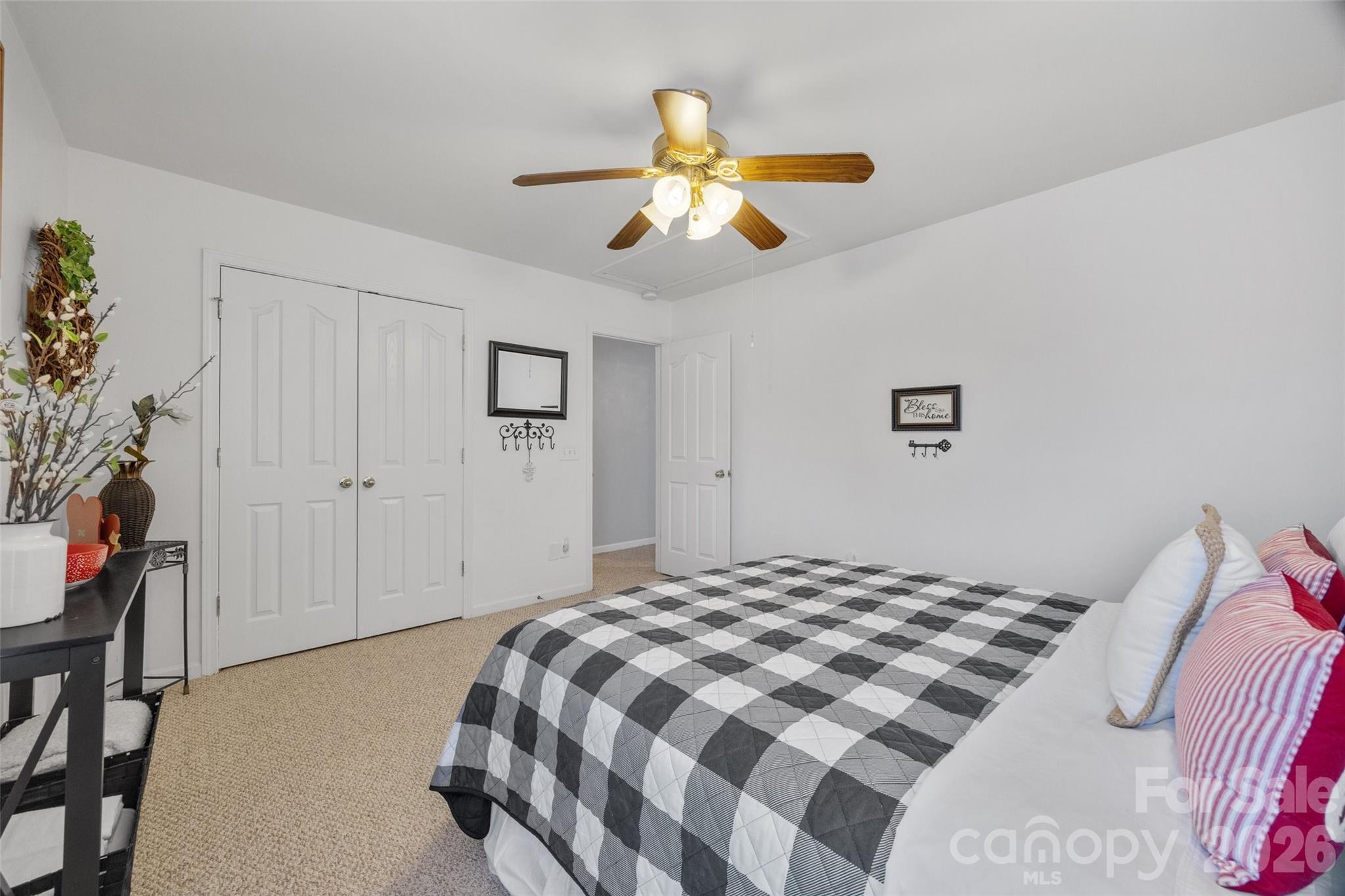 3419 Pickney Bluff Fort Mill, SC 29715 - Photo 27 of 36 a bedroom with a bed and a chandelier