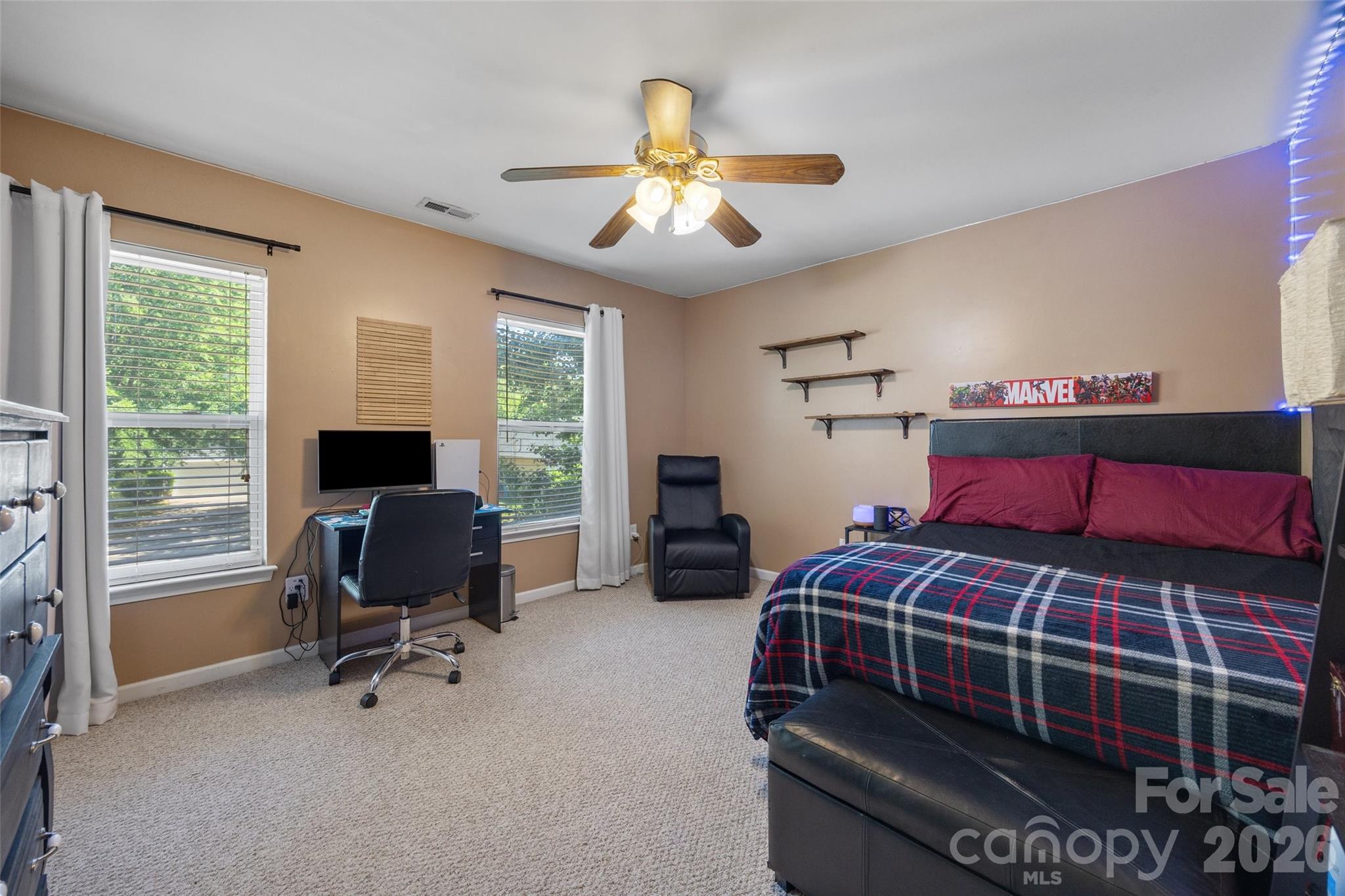 3419 Pickney Bluff Fort Mill, SC 29715 - Photo 28 of 36 a bedroom with a bed and a chandelier