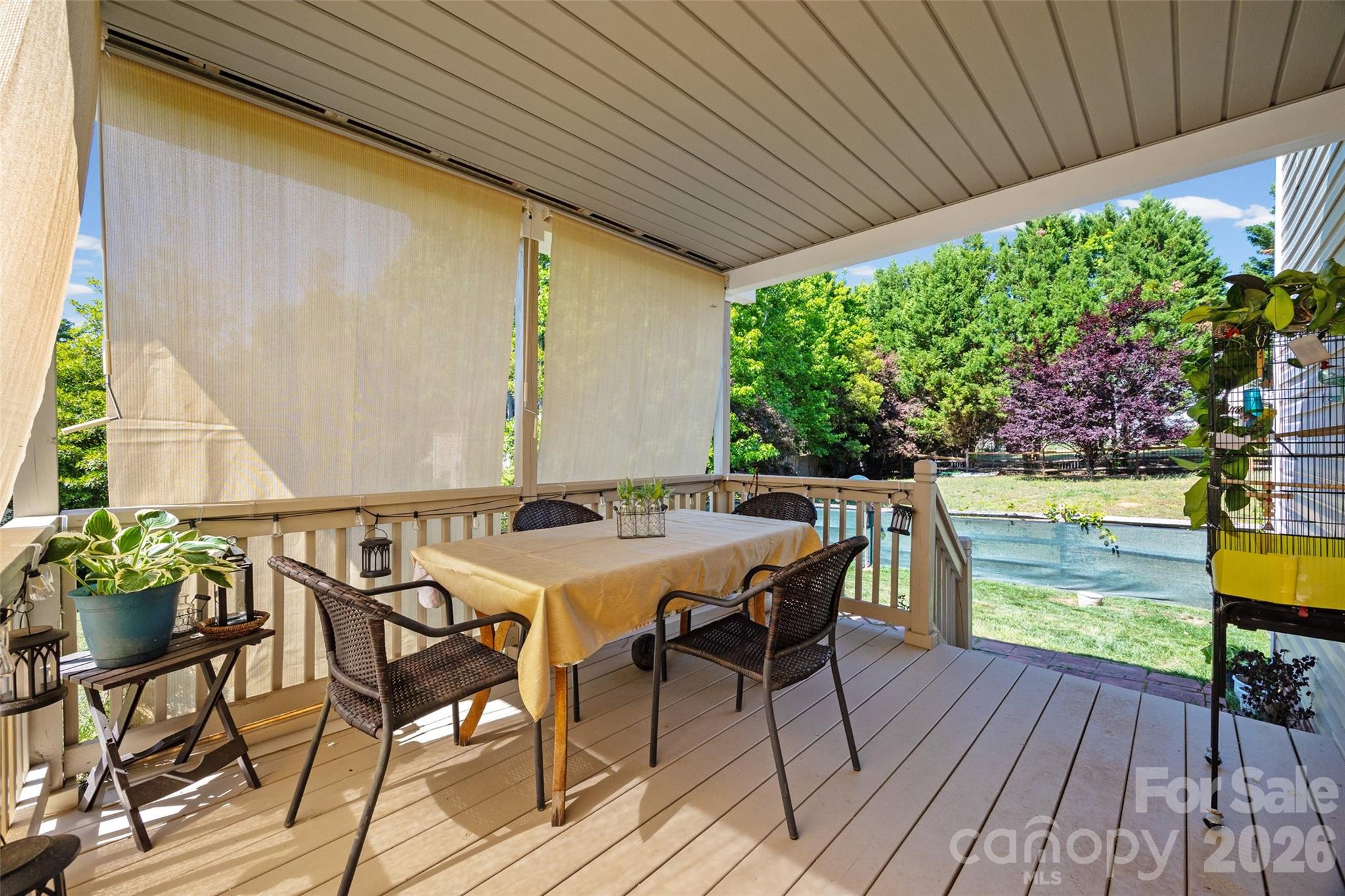 3419 Pickney Bluff Fort Mill, SC 29715 - Photo 30 of 36 a view of a patio with table and chairs a barbeque with wooden floor and plants