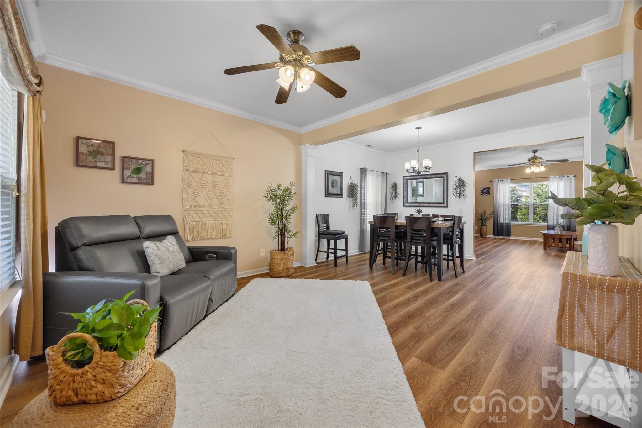 3419 Pickney Bluff Fort Mill, SC 29715 - Photo 3 of 36 a living room with furniture kitchen view and a chandelier