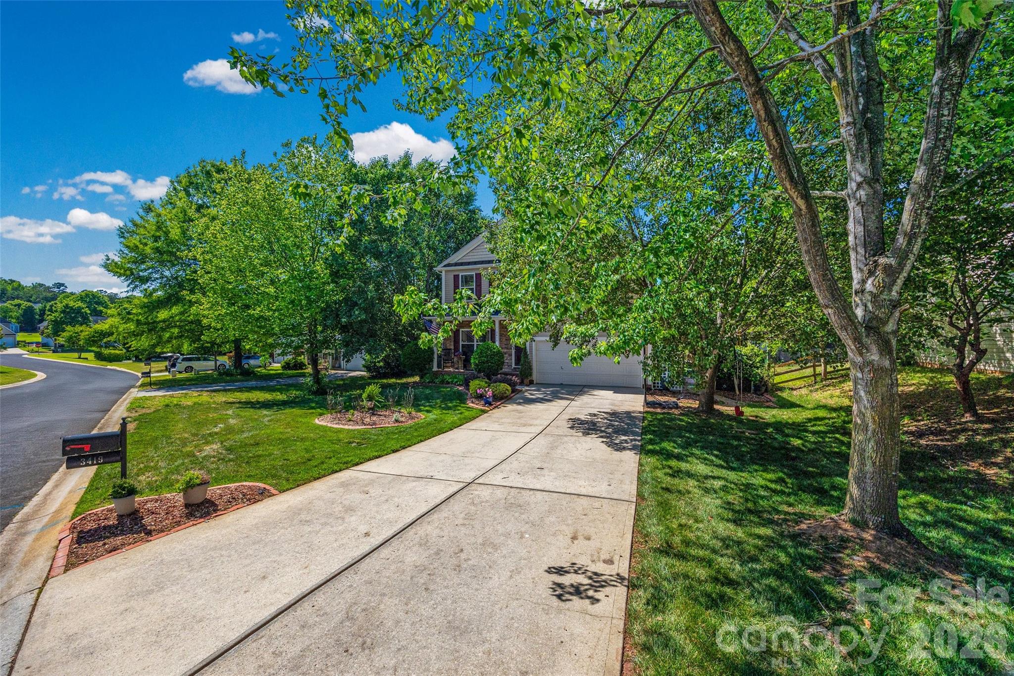 3419 Pickney Bluff Fort Mill, SC 29715 - Photo 36 of 36 a view of a garden with a tree in the garden