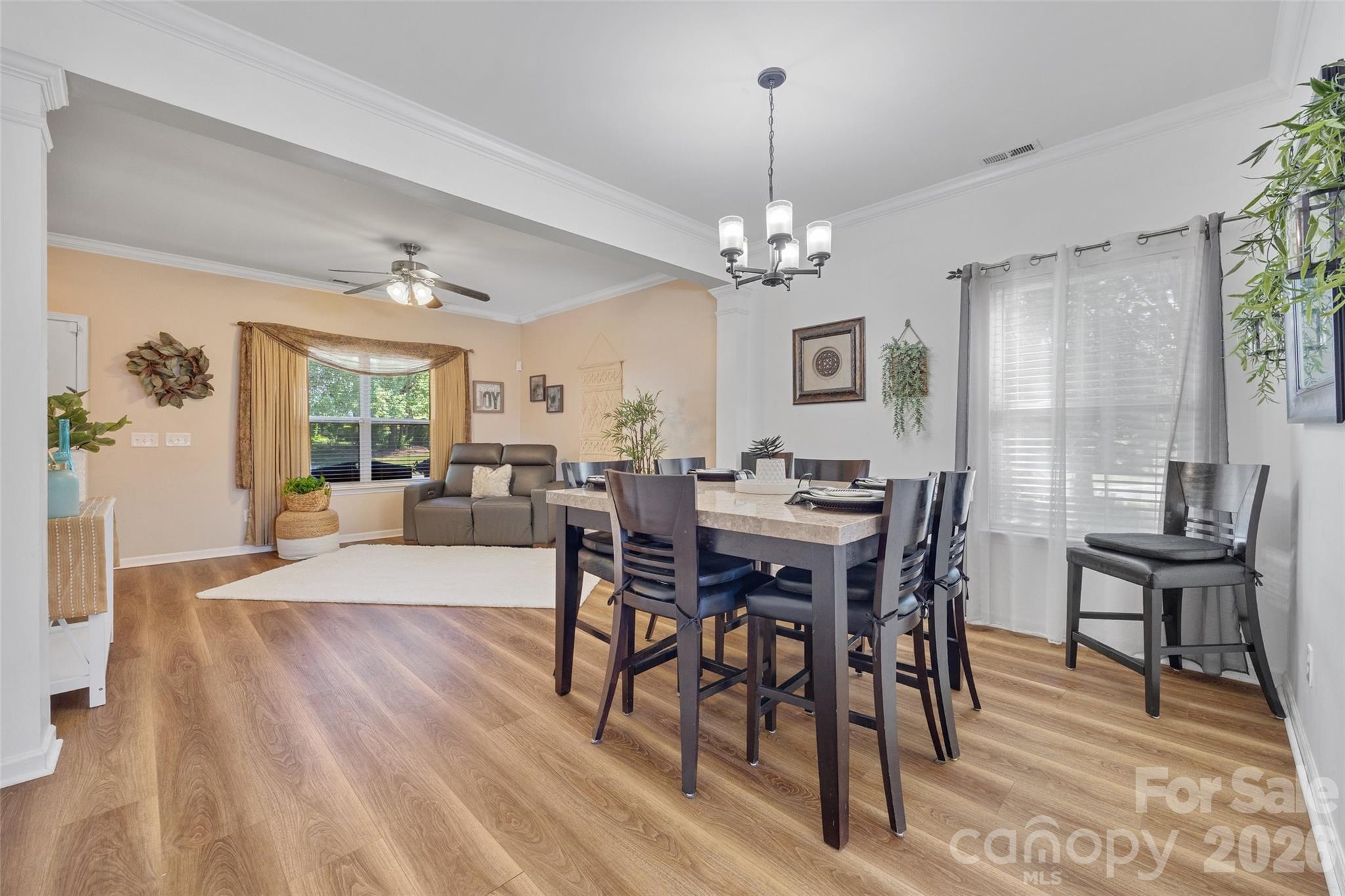 3419 Pickney Bluff Fort Mill, SC 29715 - Photo 6 of 36 a view of a dining room with furniture window and wooden floor