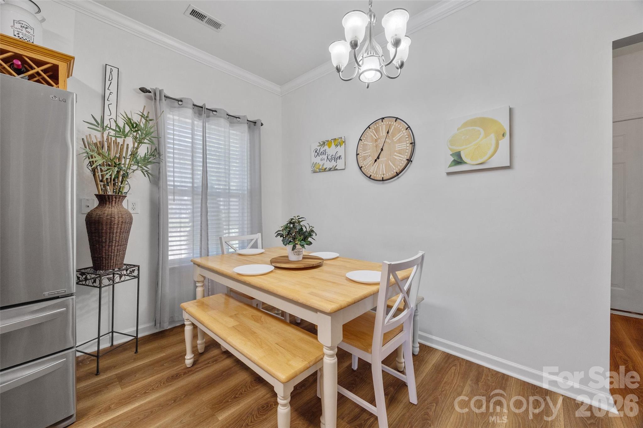 3419 Pickney Bluff Fort Mill, SC 29715 - Photo 10 of 36 a view of a dining room with furniture and a chandelier