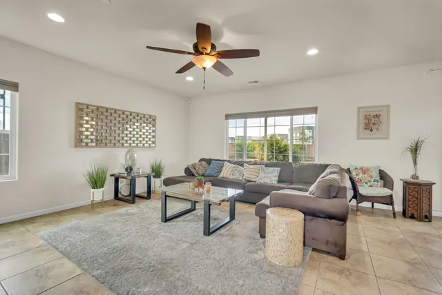 a view of a house with a yard and sitting area