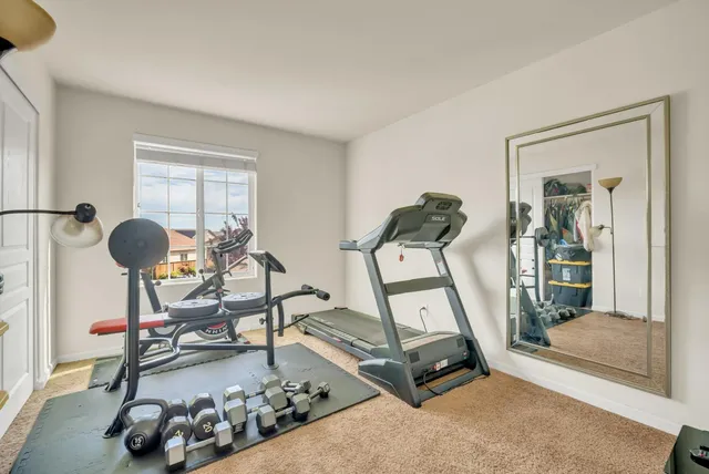 a view of a house with a yard and sitting area