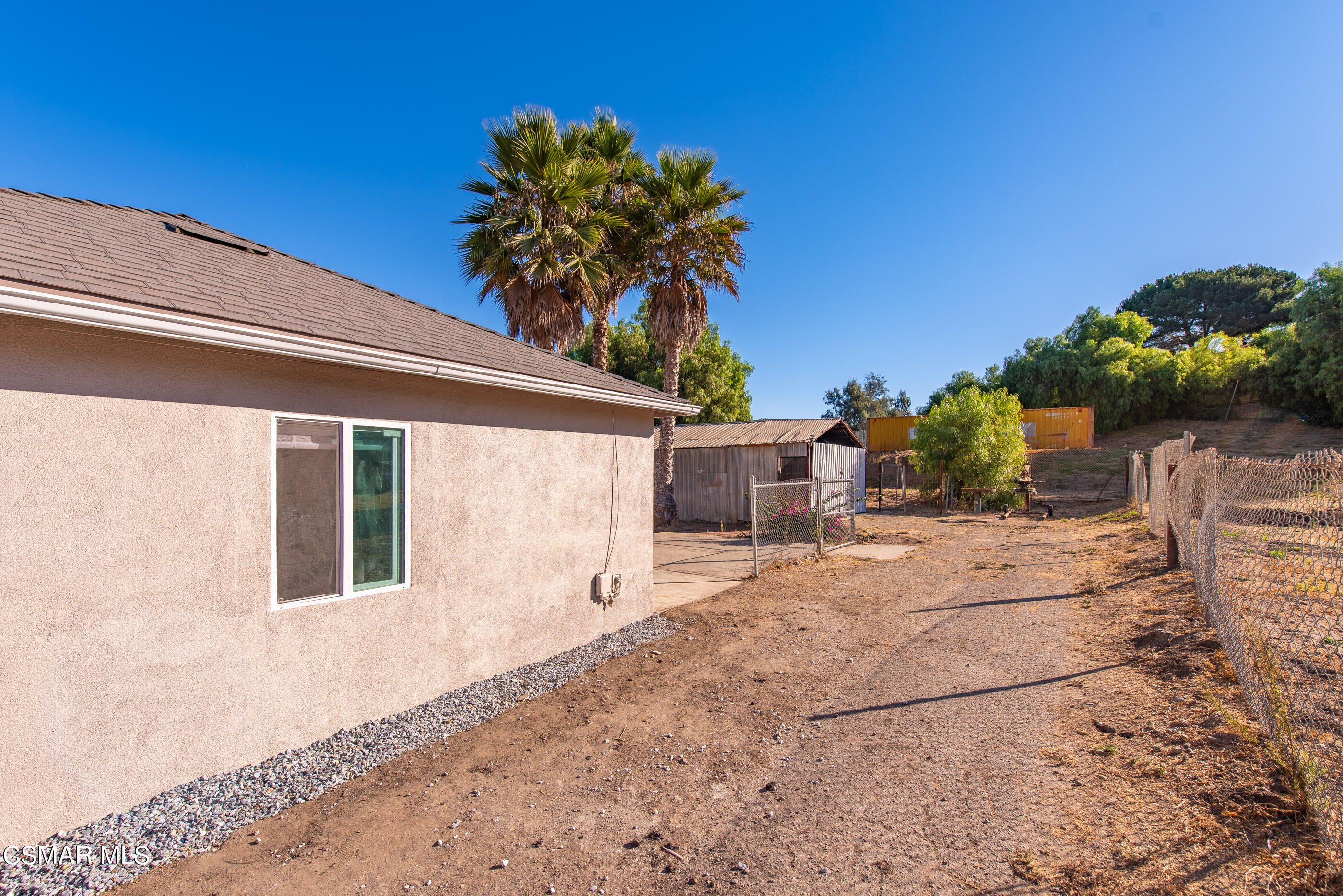 3942 Hitch Boulevard Moorpark, CA 93021 - Photo 15 of 42 a house with a yard and a wooden fence