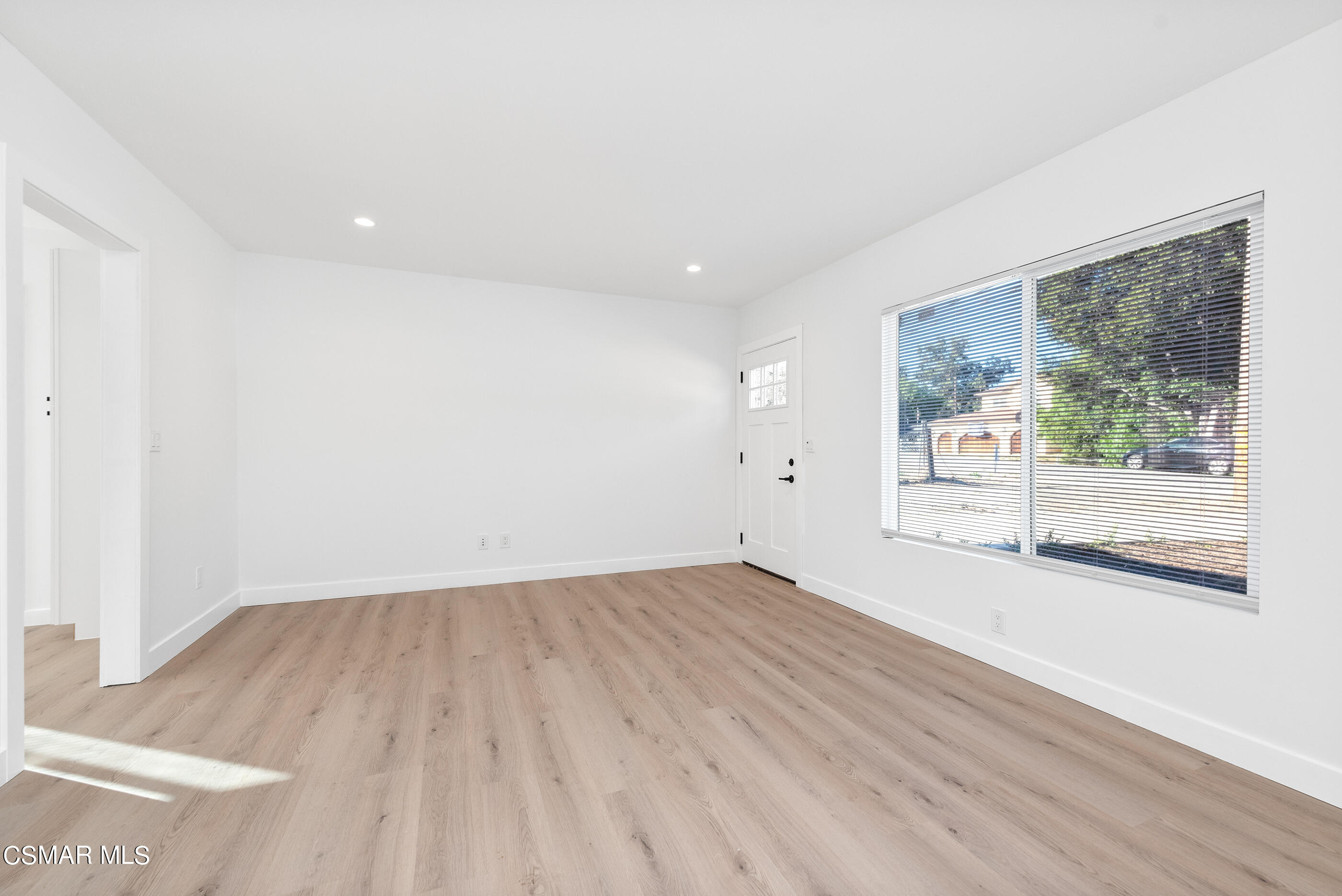 3942 Hitch Boulevard Moorpark, CA 93021 - Photo 4 of 42 an empty room with wooden floor and windows