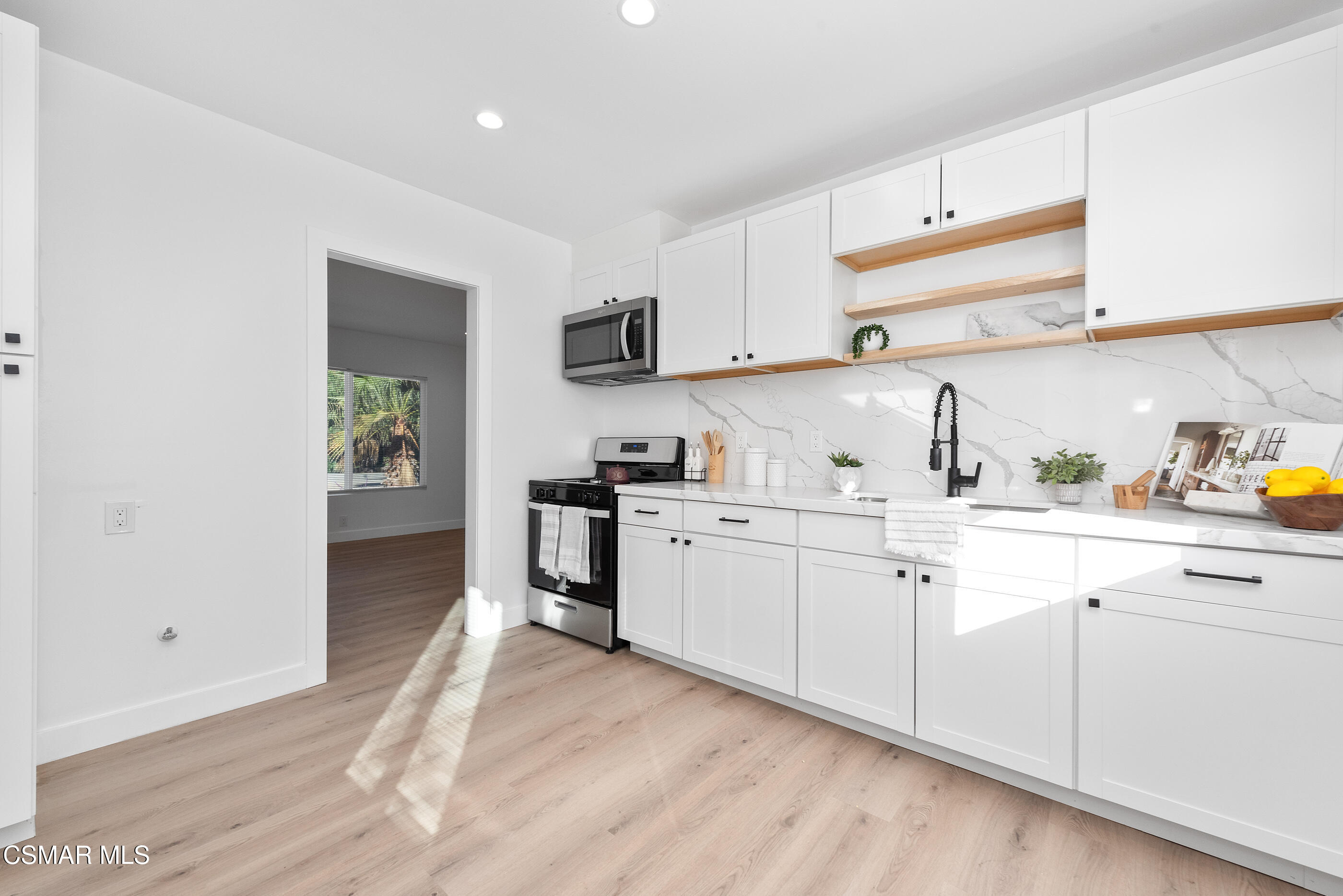 3942 Hitch Boulevard Moorpark, CA 93021 - Photo 6 of 42 a kitchen with cabinets stainless steel appliances and a window