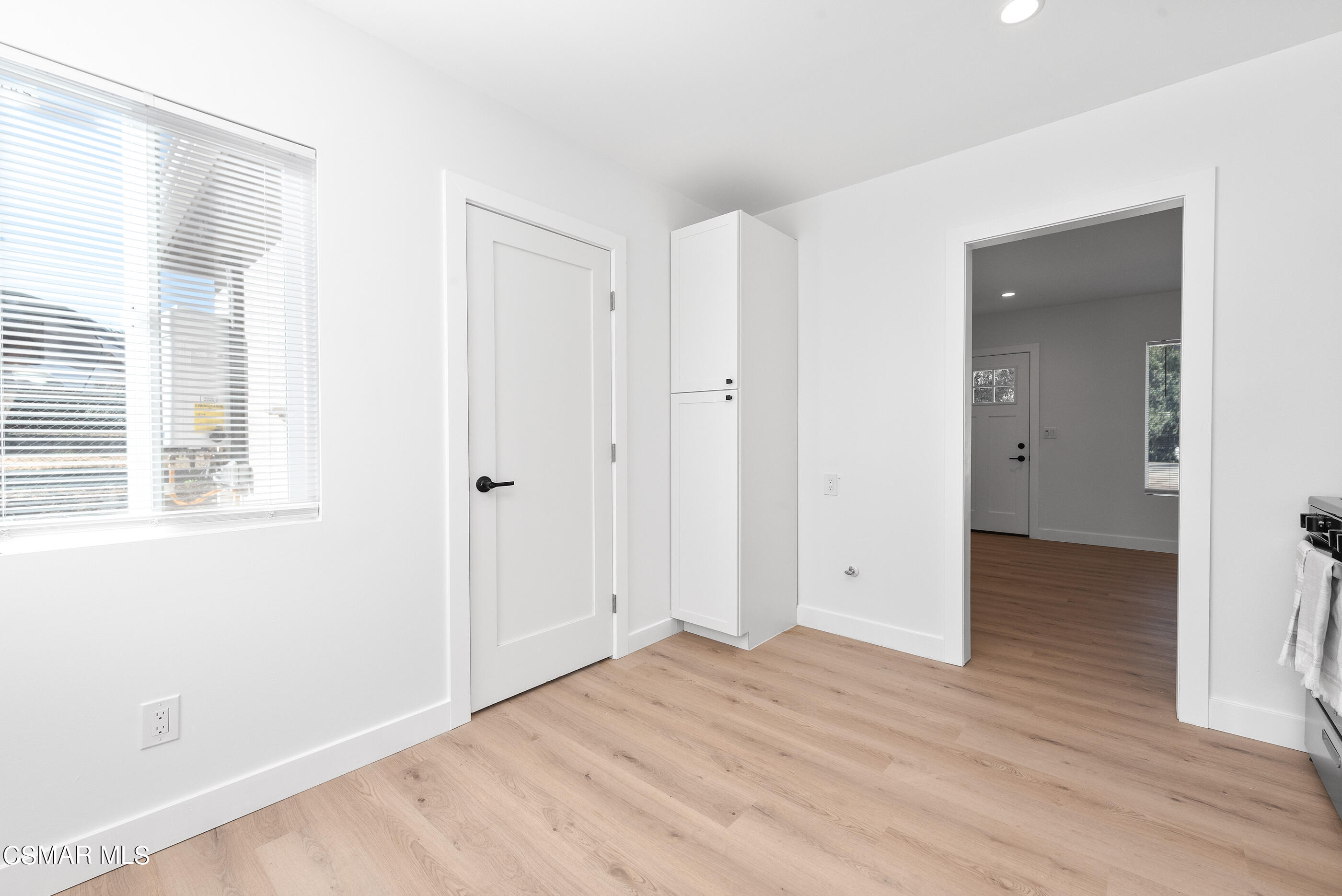 3942 Hitch Boulevard Moorpark, CA 93021 - Photo 8 of 42 a view of an empty room with wooden floor and a window