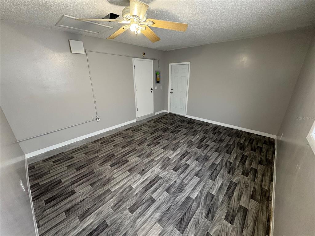 5389 Mariner Boulevard Spring Hill, FL 34609 - Photo 15 of 17 a view of a room with wooden floor
