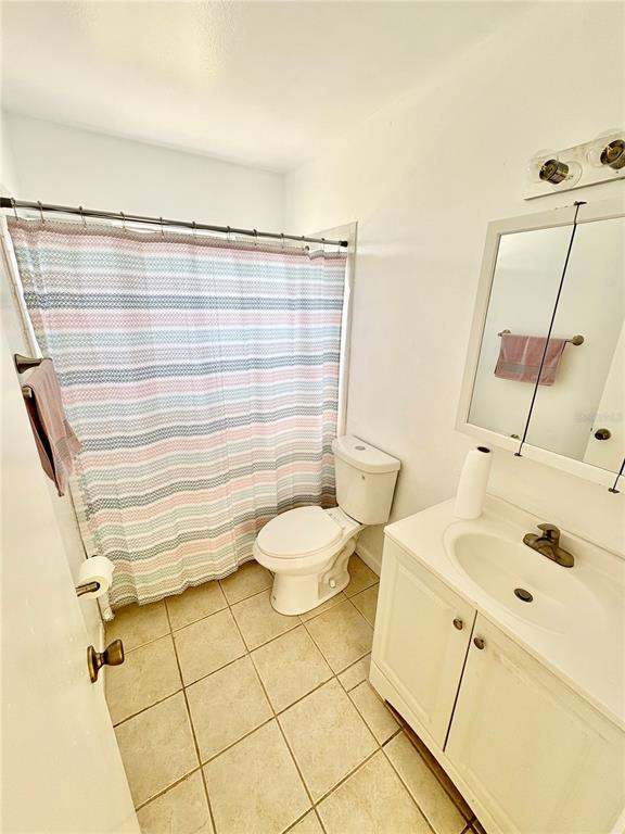 5389 Mariner Boulevard Spring Hill, FL 34609 - Photo 9 of 17 a bathroom with a sink toilet and shower