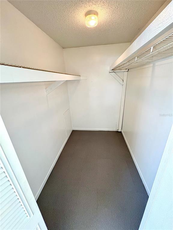 5389 Mariner Boulevard Spring Hill, FL 34609 - Photo 10 of 17 a view of a room with racks on the wall