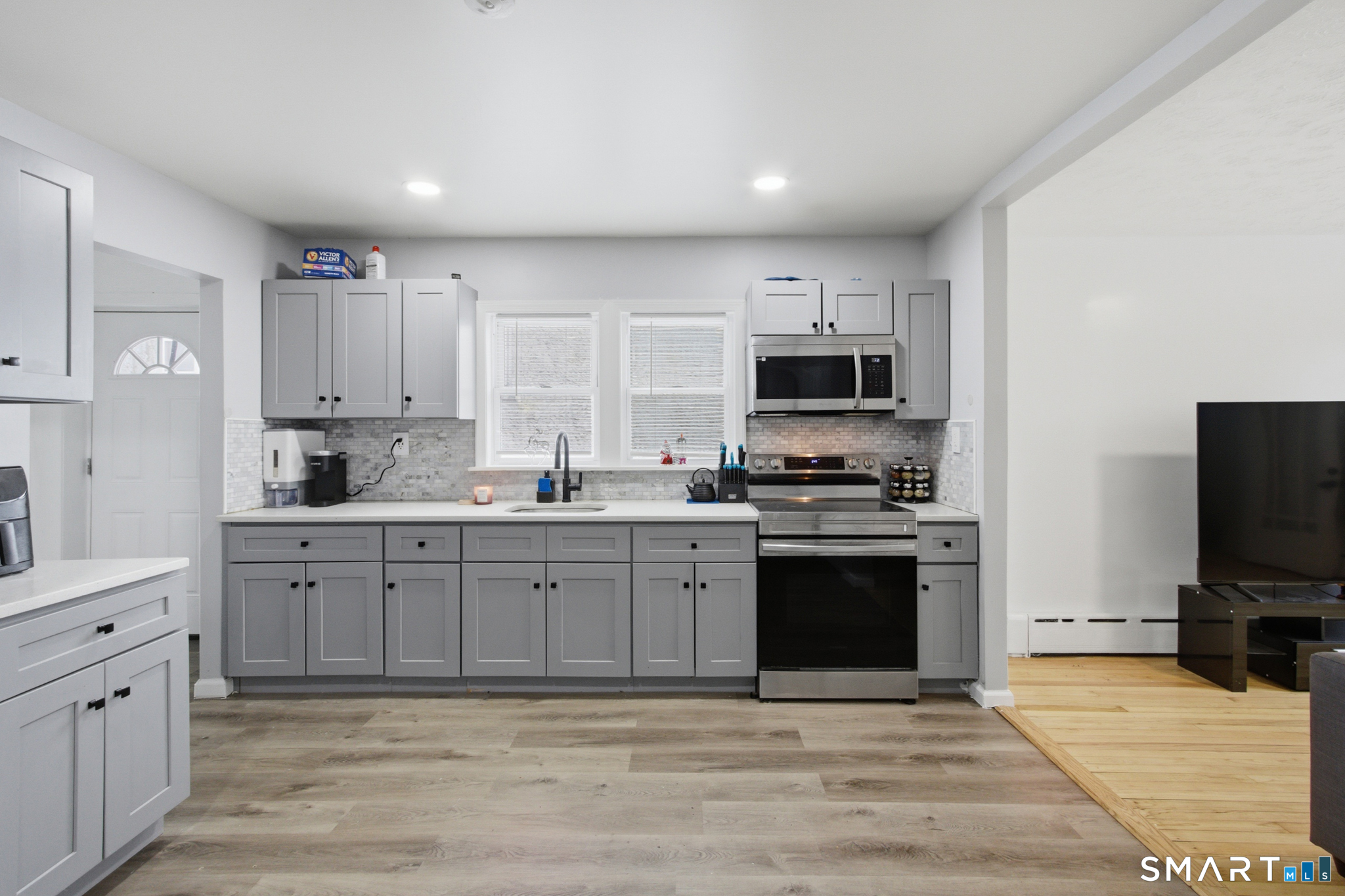 590 North Walnut Street Waterbury, CT 06704 - Photo 2 of 37 a large kitchen with cabinets and stainless steel appliances