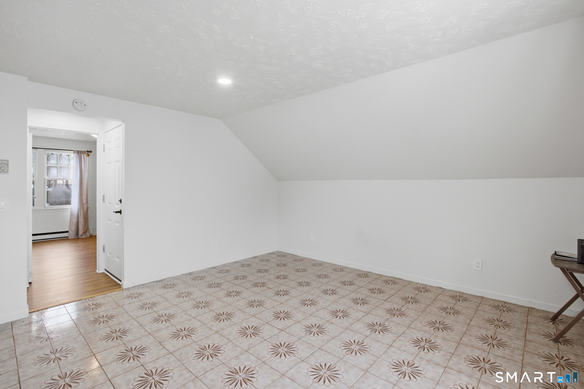 590 North Walnut Street Waterbury, CT 06704 - Photo 25 of 37 a view of a room with a bed and wooden floor