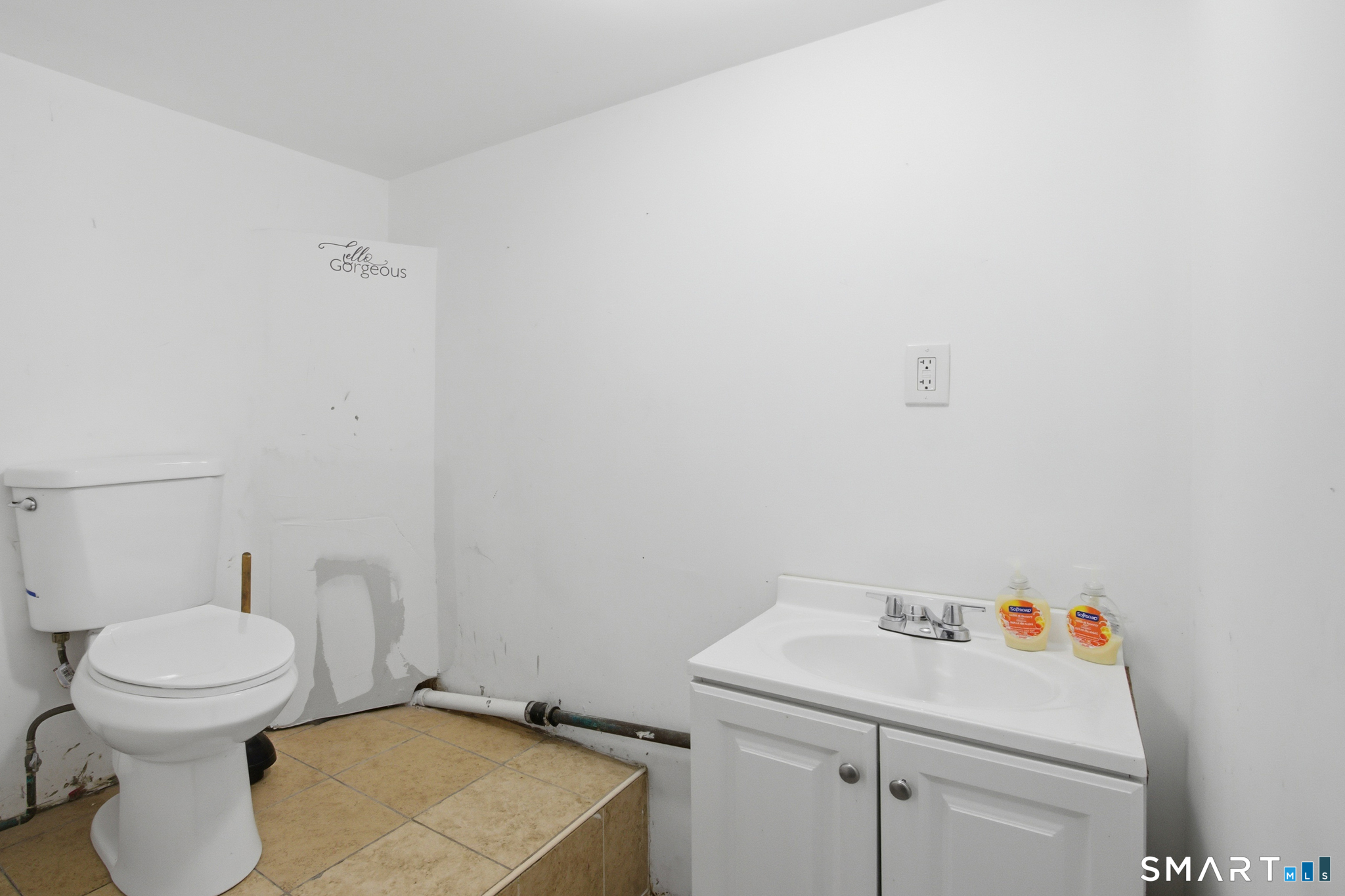 590 North Walnut Street Waterbury, CT 06704 - Photo 32 of 37 a bathroom with a sink and a toilet