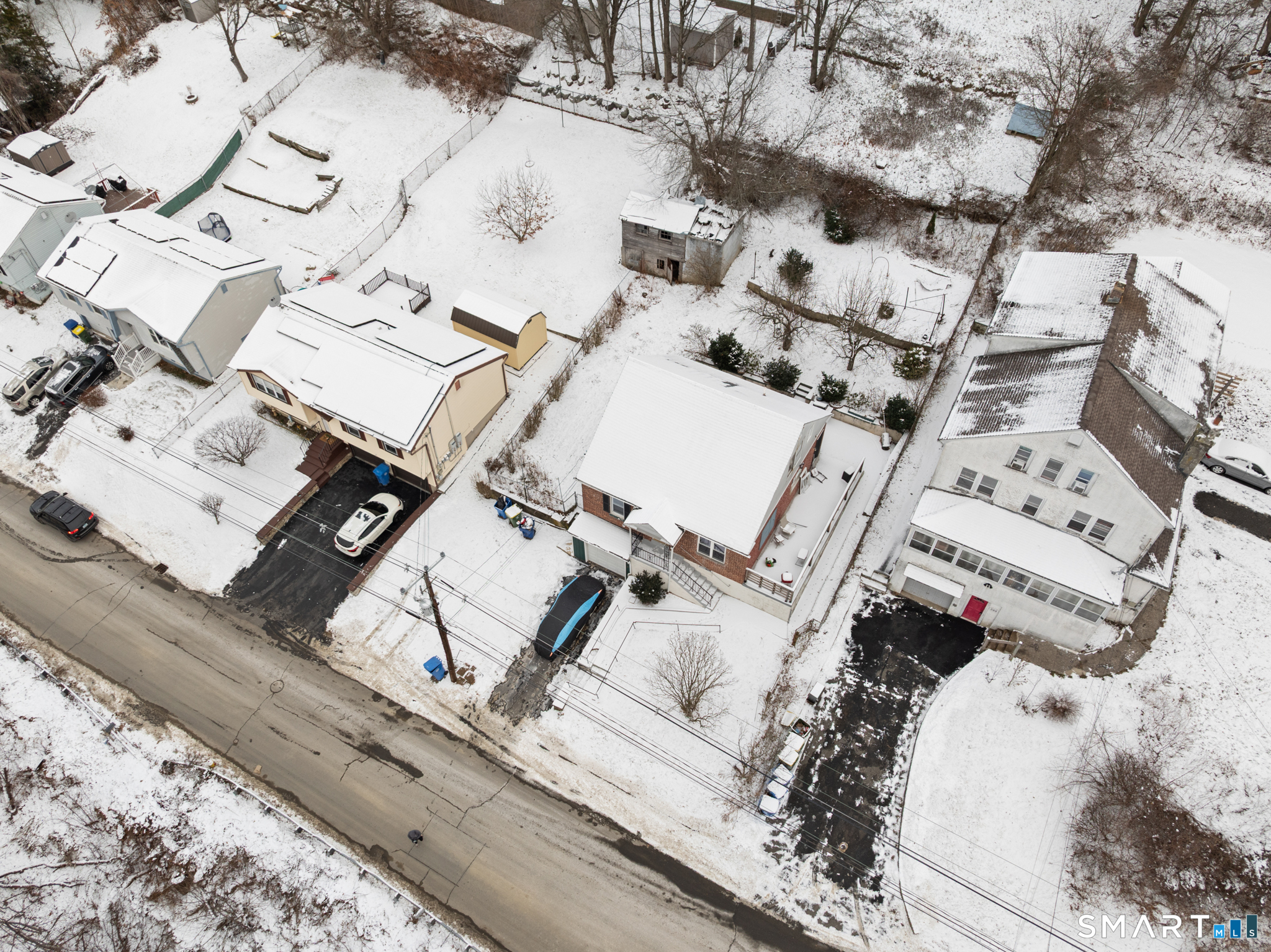 590 North Walnut Street Waterbury, CT 06704 - Photo 33 of 37 with white sheets and pillows on a bed