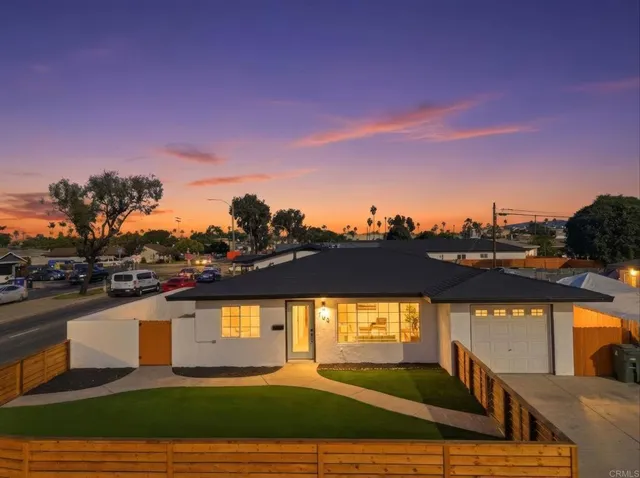 a view of a swimming pool with an outdoor seating and a city view