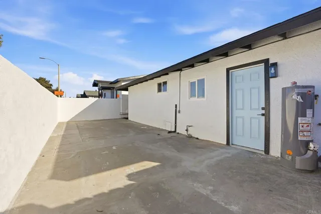 a living room with furniture potted plant and window