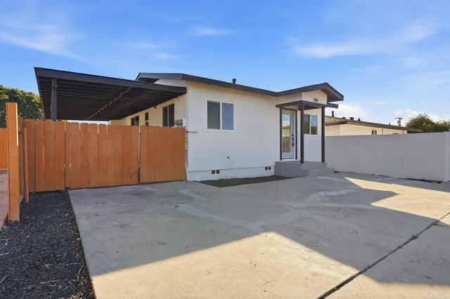 a kitchen with stainless steel appliances a sink stove and refrigerator