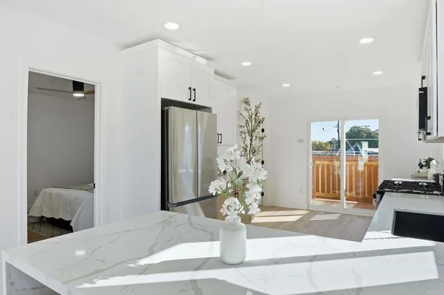 a kitchen with a sink stove top oven and microwave