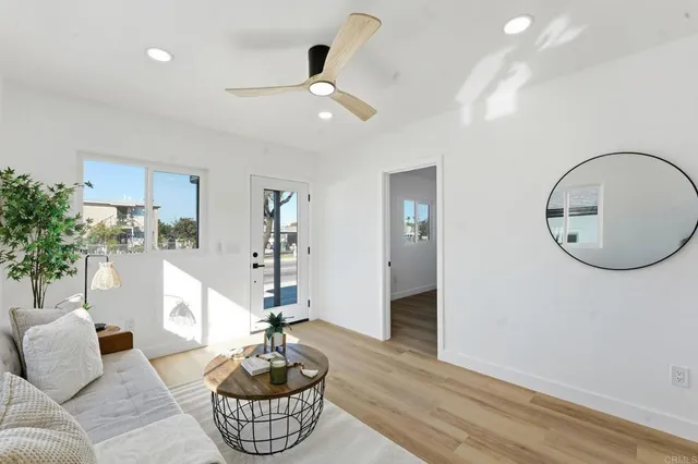 a kitchen with stainless steel appliances a stove a microwave a sink and cabinets