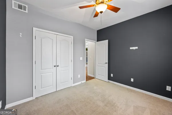 a kitchen with stainless steel appliances granite countertop a sink stove microwave and refrigerator