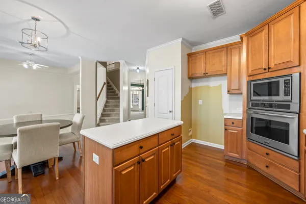 a bathroom with a double vanity sink and mirror with shower