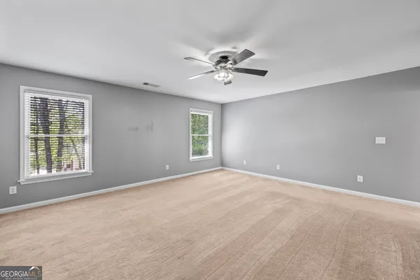 an aerial view of a house with yard swimming pool and outdoor seating