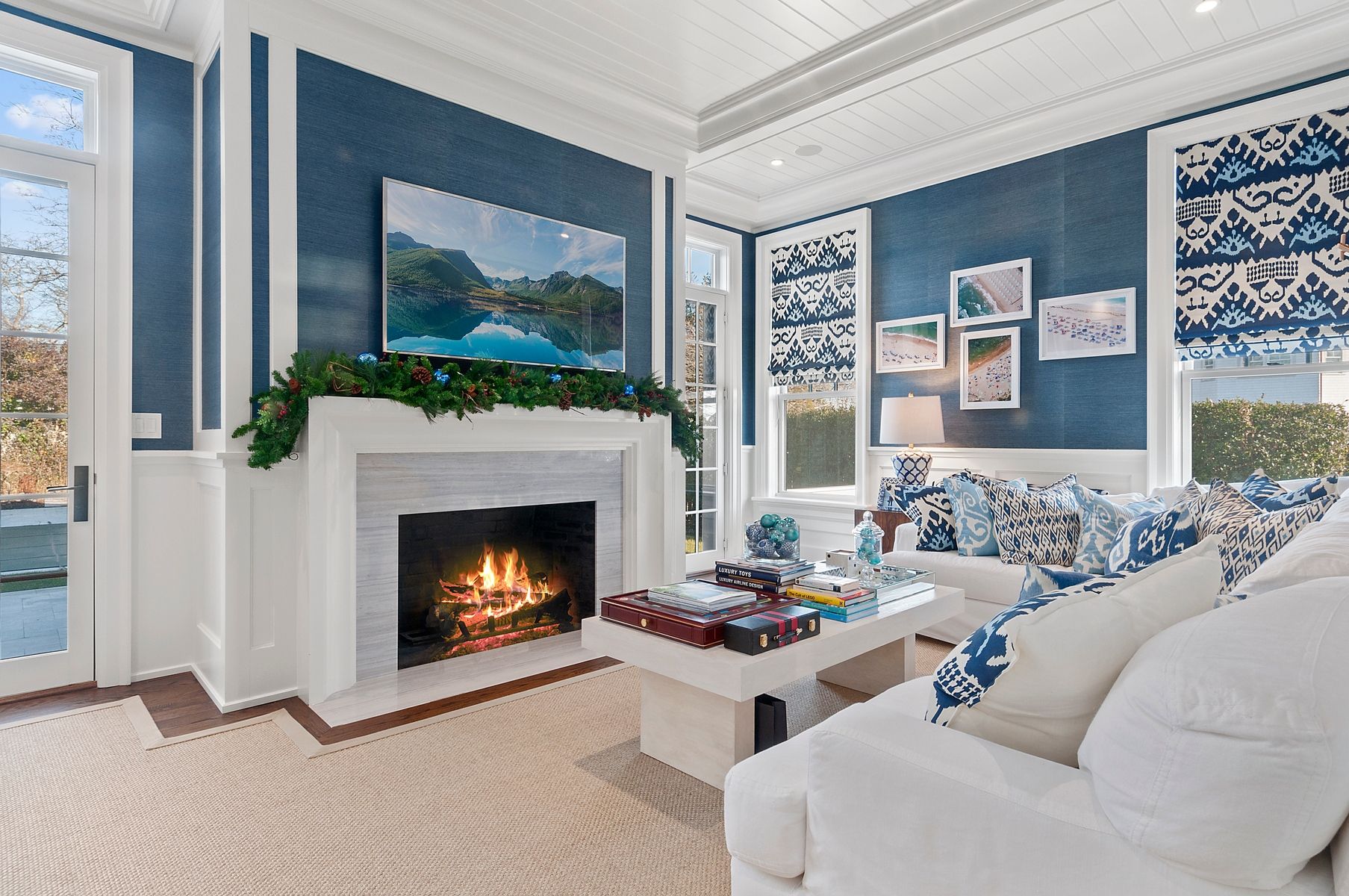 107 Wickapogue Road Southampton, NY 11968 - Photo 7 of 18 a living room with couches a fireplace and a flat screen tv
