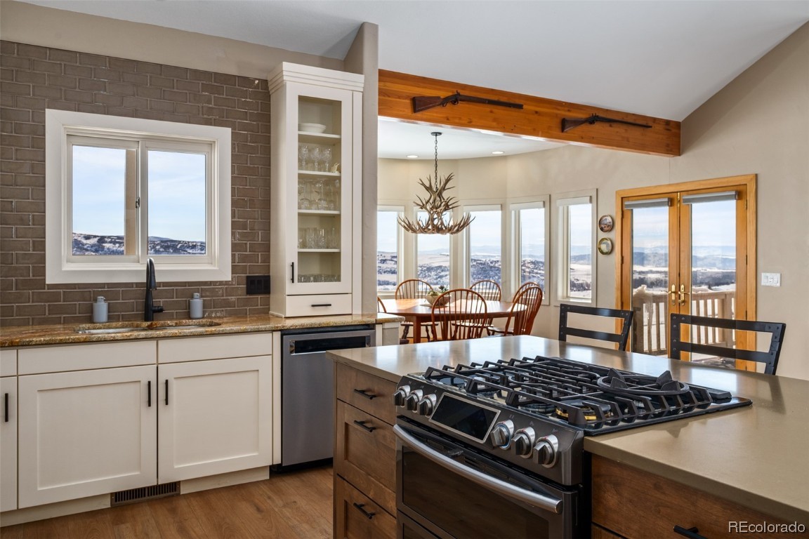 43750 Diamondback Way Steamboat Springs, CO 80487 - Photo 11 of 50 a kitchen with a stove a sink and cabinets
