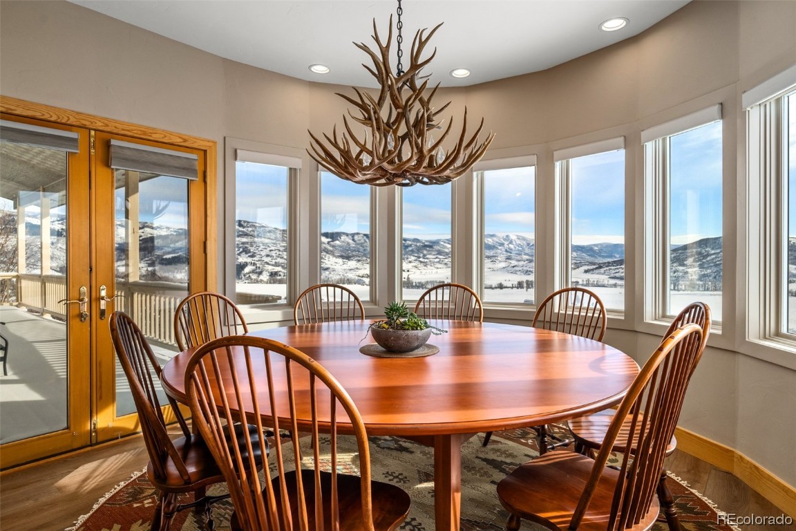 43750 Diamondback Way Steamboat Springs, CO 80487 - Photo 12 of 50 a view of a dining room with furniture window and outside view