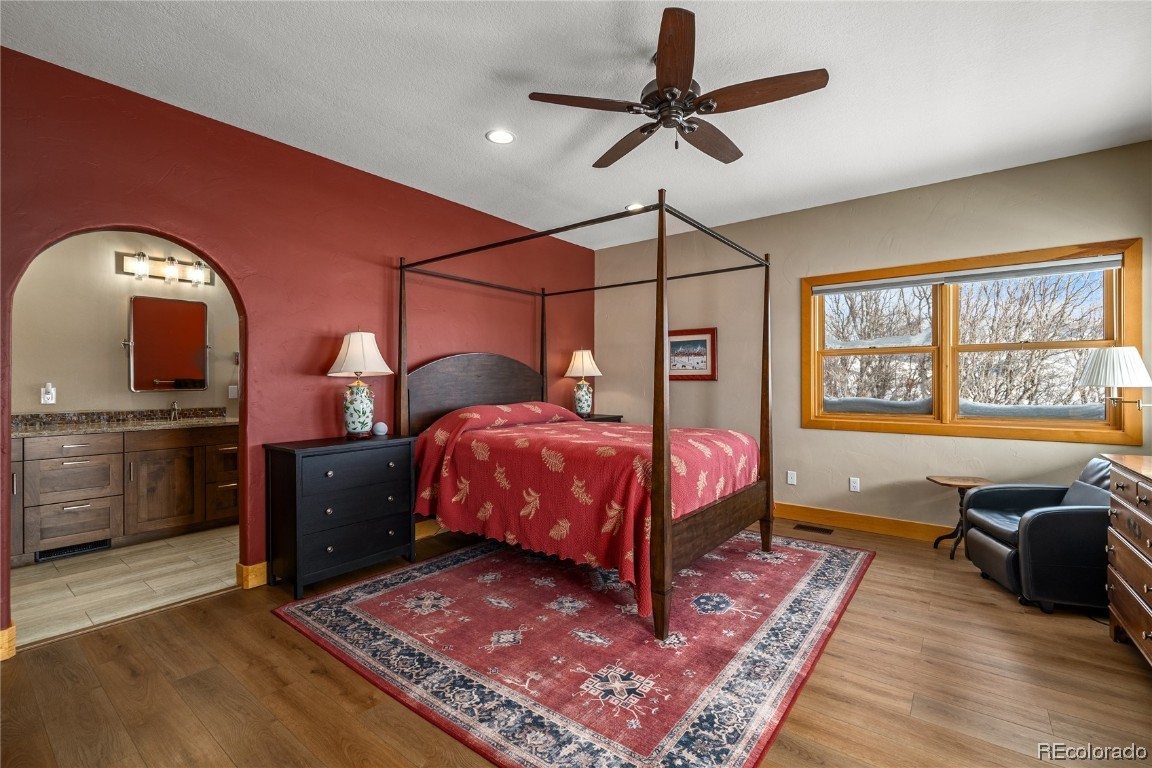 43750 Diamondback Way Steamboat Springs, CO 80487 - Photo 16 of 50 a bed room with a bed and a chandelier